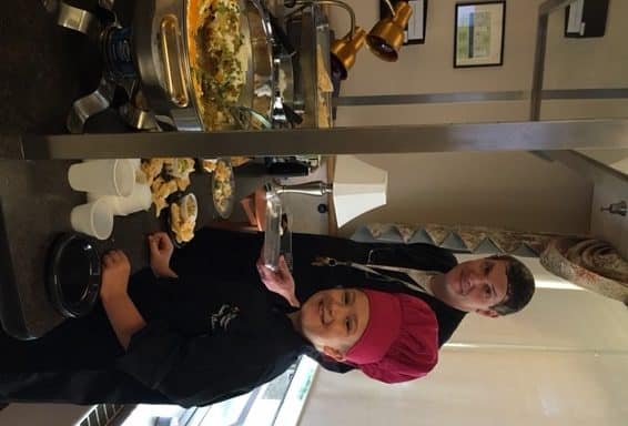 Nine year old Corrine Godlewski of Washington Township combined her love of volunteering and cooking into one awesome demonstration for residents, staff and guests. Here she and UMC at Pitman Executive Chef, Rich Schleeter prepare and serve taco dip and chicken quesadillas during his weekly cooking demonstration.